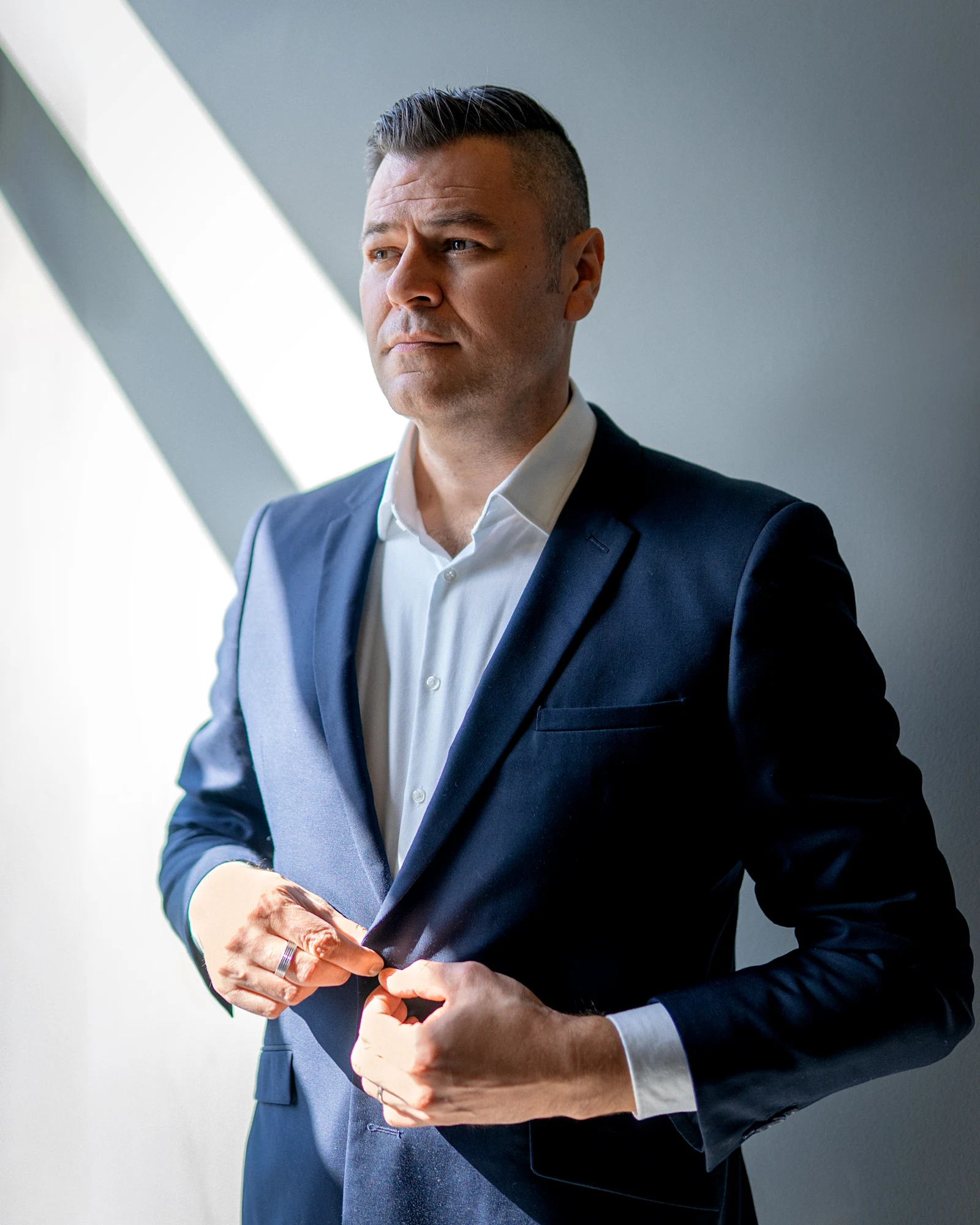 Mircea Lechaciu in a navy suit